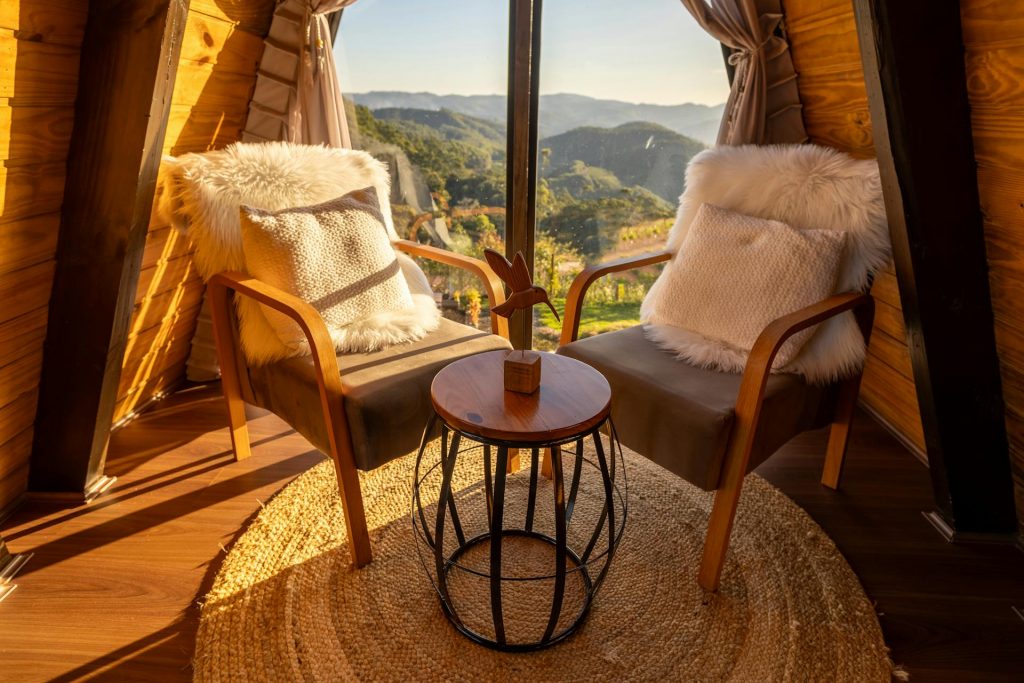 Chairs and a Coffee Table by the Window with a Mountain View Via pexels
